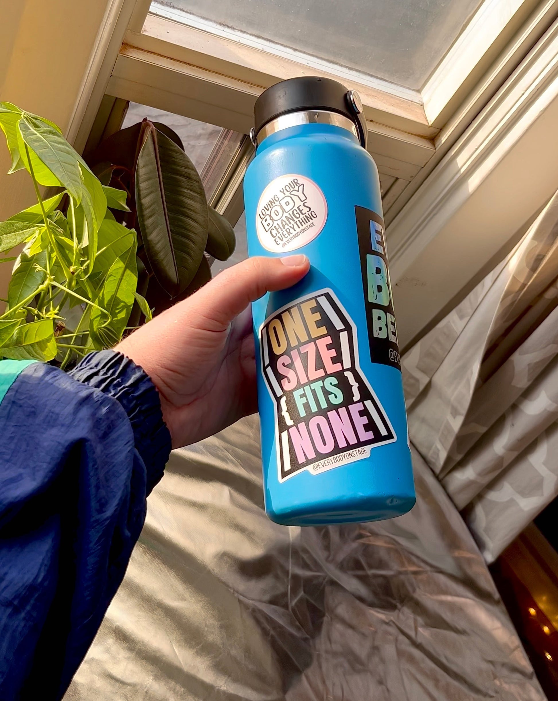 A Blue water bottle featuring the sticker collection
